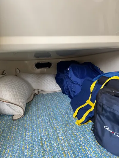  Yacht Photos Pics Interior cabin of 2020 Chris-Craft Catalina 30 with bedding and bags.