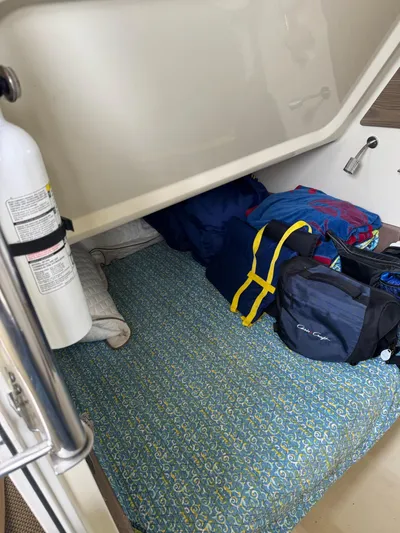  Yacht Photos Pics Interior cabin of 2020 Chris-Craft Catalina 30 with bedding and bags.