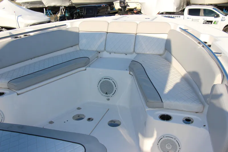 III Yacht Photos Pics 2020 Sea Fox 328 Commander boat interior with cushioned seating and speakers.