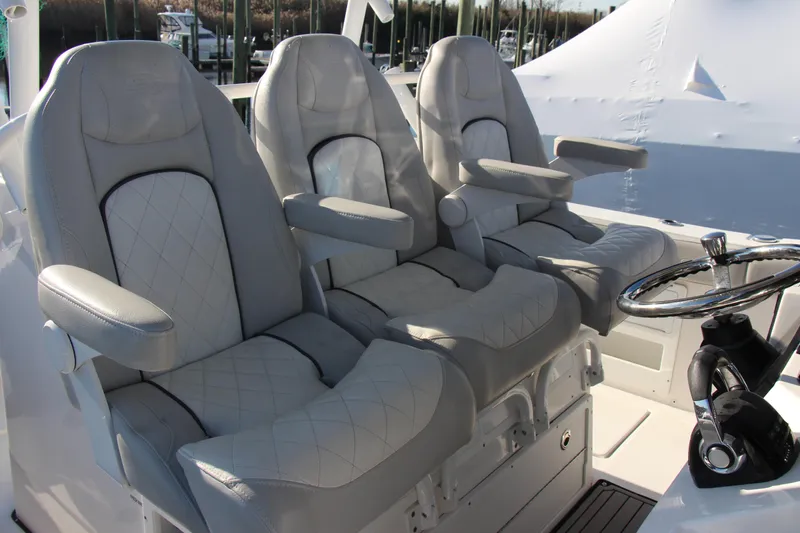 III Yacht Photos Pics Luxurious seating on 2020 Sea Fox 328 Commander boat with steering wheel.