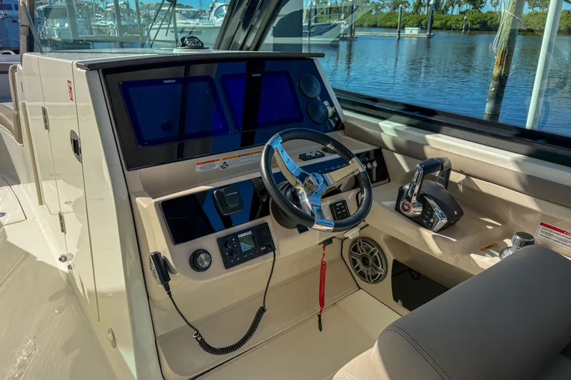  Yacht Photos Pics Interior view of 2025 Boston Whaler 330 Vantage cockpit.