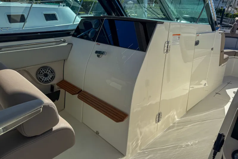  Yacht Photos Pics Interior of 2025 Boston Whaler 330 Vantage with seating and speaker.