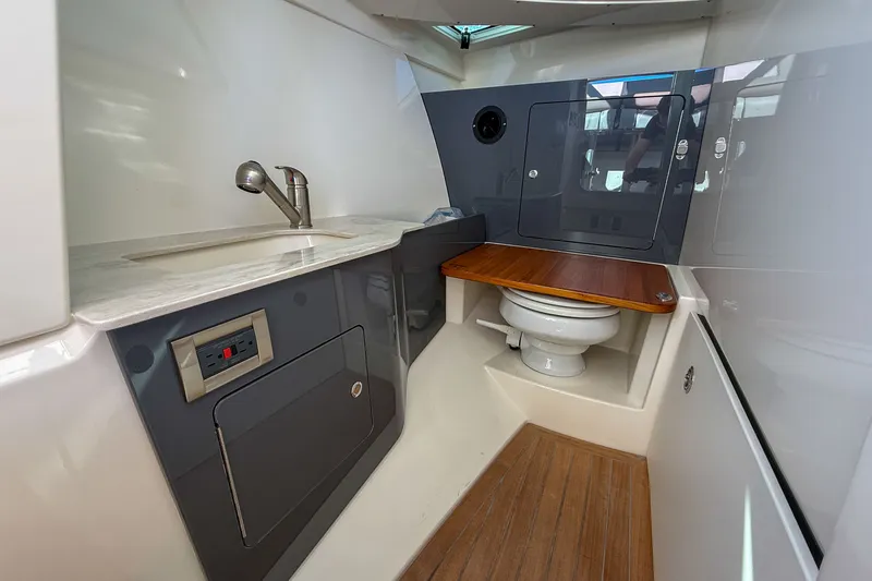  Yacht Photos Pics Interior of 2025 Boston Whaler 330 Vantage with toilet and sink.