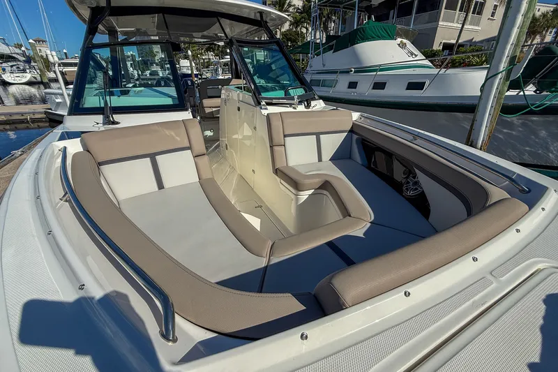  Yacht Photos Pics 2025 Boston Whaler 330 Vantage with luxurious seating area in harbor.