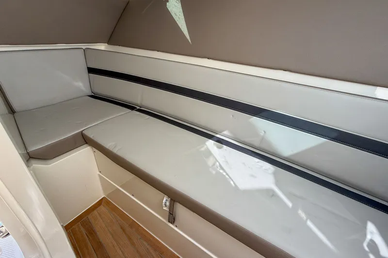  Yacht Photos Pics Interior of 2025 Boston Whaler 330 Vantage with cushioned seating.