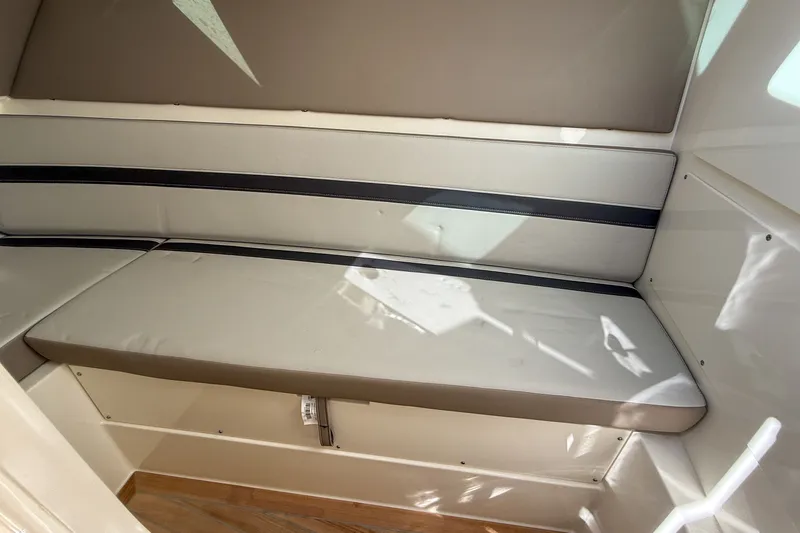 Yacht Photos Pics Interior of 2025 Boston Whaler 330 Vantage with cushioned seating.
