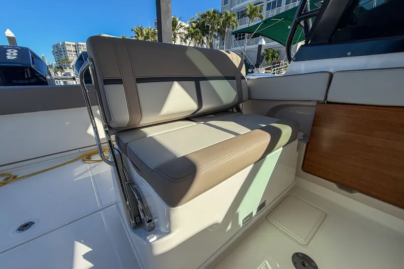  Yacht Photos Pics Seating area of 2025 Boston Whaler 330 Vantage in sunlight.