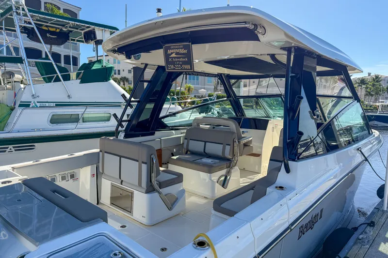  Yacht Photos Pics 2025 Boston Whaler 330 Vantage boat docked at marina.