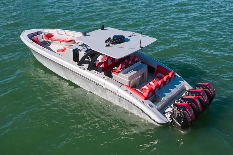  Yacht Photos Pics 2017 Midnight Express 43' Open boat with red seating, cruising on clear water.