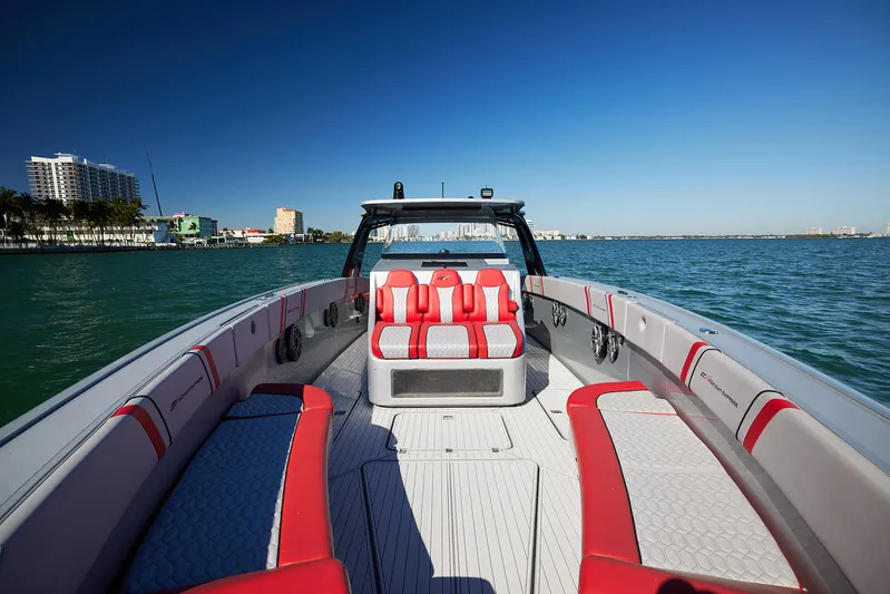  Yacht Photos Pics 2017 Midnight Express 43' Open boat with red and white seating on calm water.