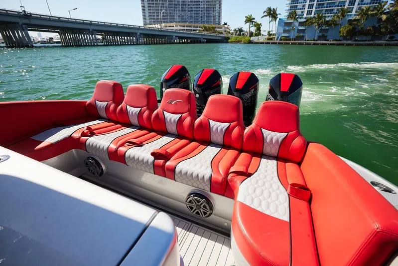  Yacht Photos Pics 2017 Midnight Express 43' Open boat with red and gray seating, cruising on a sunny day.
