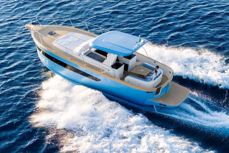  Yacht Photos Pics 2024 Patrone 45 OPEN yacht cruising on blue ocean waters.