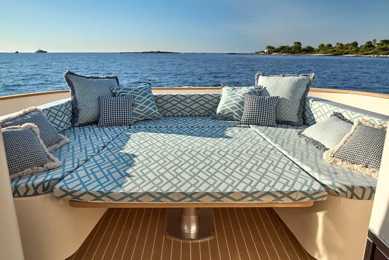  Yacht Photos Pics Luxurious seating area on Patrone 45 OPEN yacht, 2024, with ocean view and decorative cushions.