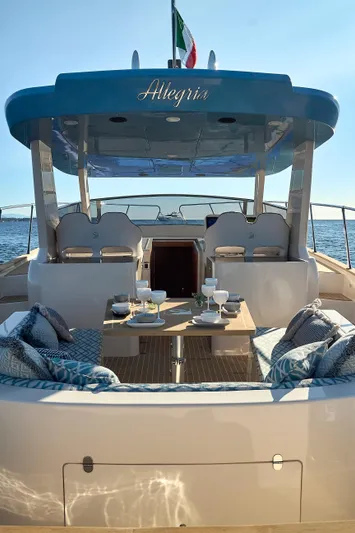  Yacht Photos Pics Luxury Patrone 45 OPEN yacht interior, 2024 model, with elegant seating and dining setup at sea.
