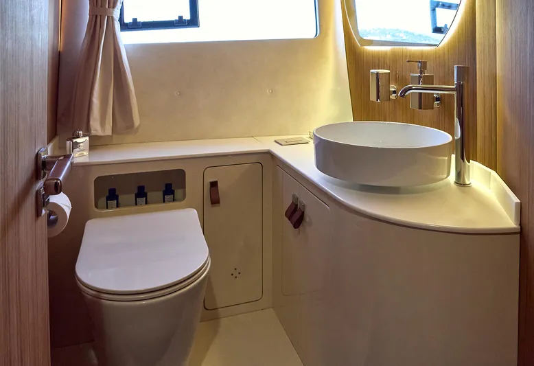  Yacht Photos Pics Modern bathroom interior on 2024 Patrone 45 OPEN yacht, featuring sleek fixtures and elegant design.