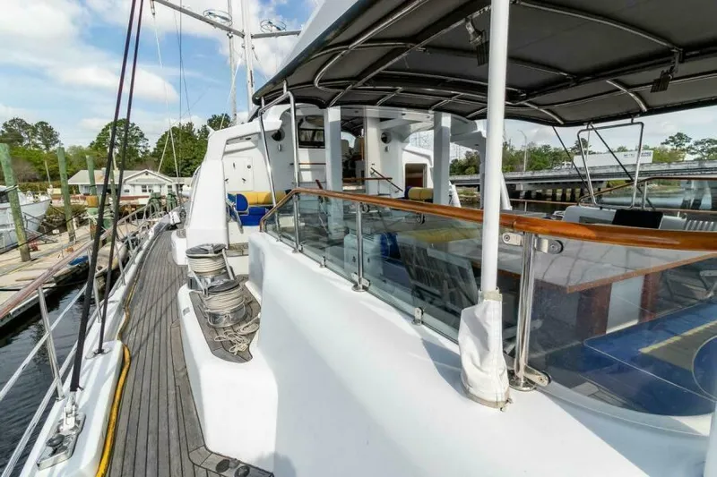  Yacht Photos Pics Luxurious 2004 Pendennis 155 yacht deck with modern amenities and sleek design.