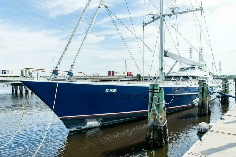  Yacht Photos Pics Luxury Pendennis 155 yacht docked, 2004 model, sleek blue design, moored at marina.