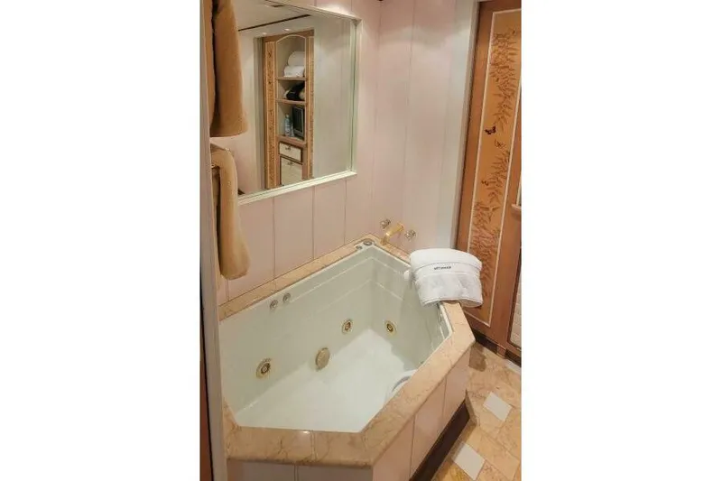  Yacht Photos Pics Luxurious bathroom with jacuzzi tub on 2004 Pendennis 155 yacht.