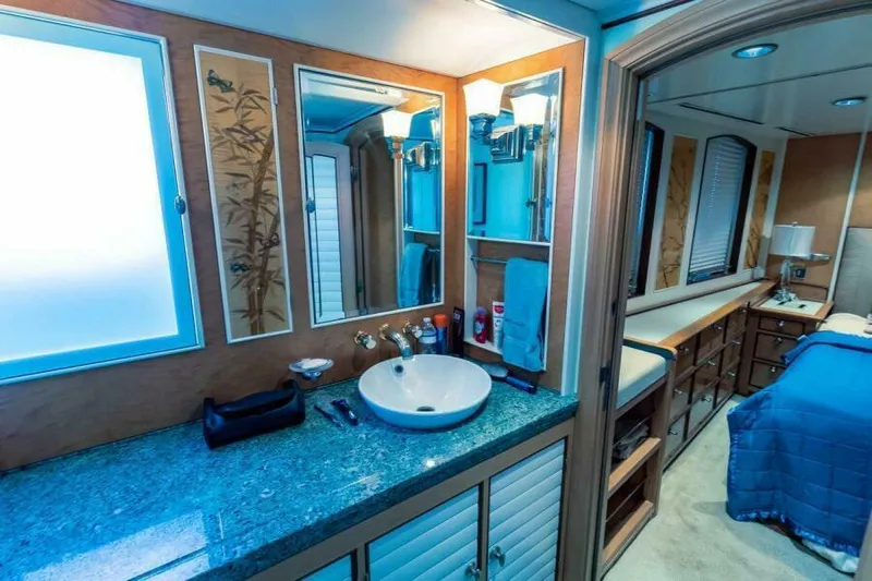  Yacht Photos Pics Luxurious bathroom and bedroom interior on a 2004 Pendennis 155 yacht.