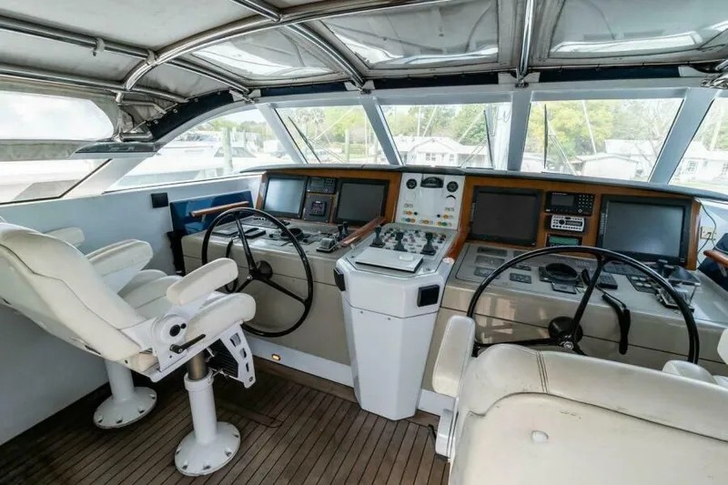  Yacht Photos Pics Cockpit of 2004 Pendennis 155 yacht with steering wheels and navigation equipment.
