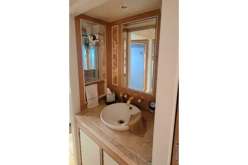  Yacht Photos Pics Luxurious bathroom vanity on Pendennis 155 yacht, featuring elegant sink and mirror, 2004 model.