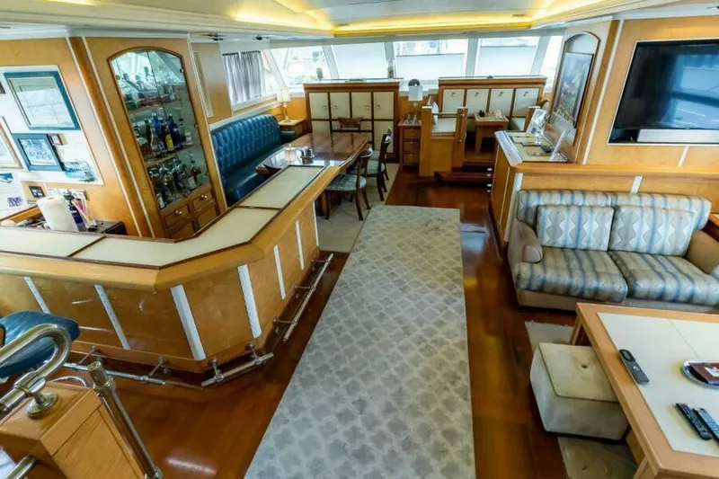  Yacht Photos Pics Luxurious interior of 2004 Pendennis 155 yacht with elegant seating and dining area.