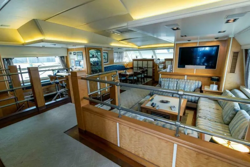  Yacht Photos Pics Luxurious interior of 2004 Pendennis 155 yacht with elegant seating and modern amenities.