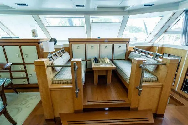  Yacht Photos Pics Luxurious Pendennis 155 yacht interior with elegant seating and chessboard, 2004 model.