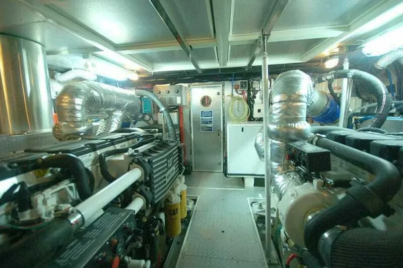 Always Something Yacht Photos Pics Engine room of 2009 Grand Harbour 66 Motoryacht, featuring complex machinery and piping.
