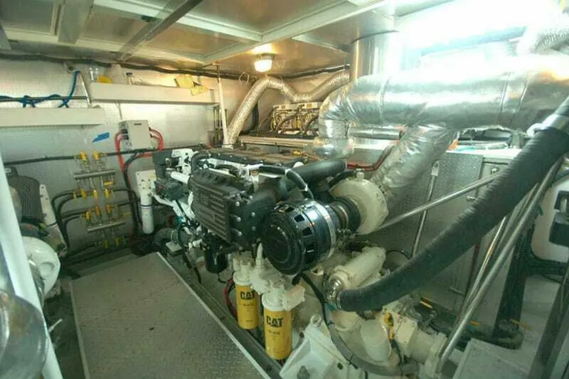 Always Something Yacht Photos Pics Engine room of 2009 Grand Harbour 66 Motoryacht with CAT machinery and complex piping system.