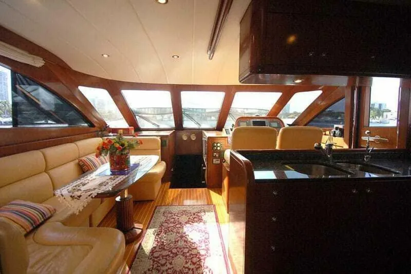 Always Something Yacht Photos Pics Luxurious interior of 2009 Grand Harbour 66 Motoryacht with elegant seating and panoramic windows.