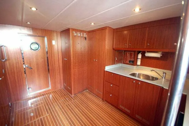 Always Something Yacht Photos Pics Luxurious wood-finished kitchen interior of 2009 Grand Harbour 66 Motoryacht.