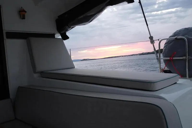 Jack Yacht Photos Pics 2024 Lagoon 42 yacht interior with sunset view over the ocean.