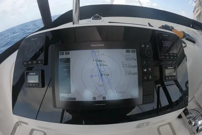 Jack Yacht Photos Pics 2024 Lagoon 42 yacht navigation system with Raymarine display and Yanmar controls.