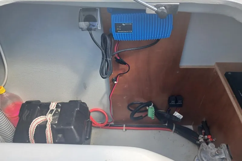 Jack Yacht Photos Pics Electrical setup in a 2024 Lagoon 42 boat, featuring a battery and charger.