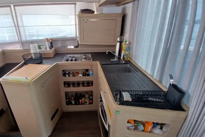 Jack Yacht Photos Pics Modern kitchen in 2024 Lagoon 42 yacht with sleek design and ample storage.