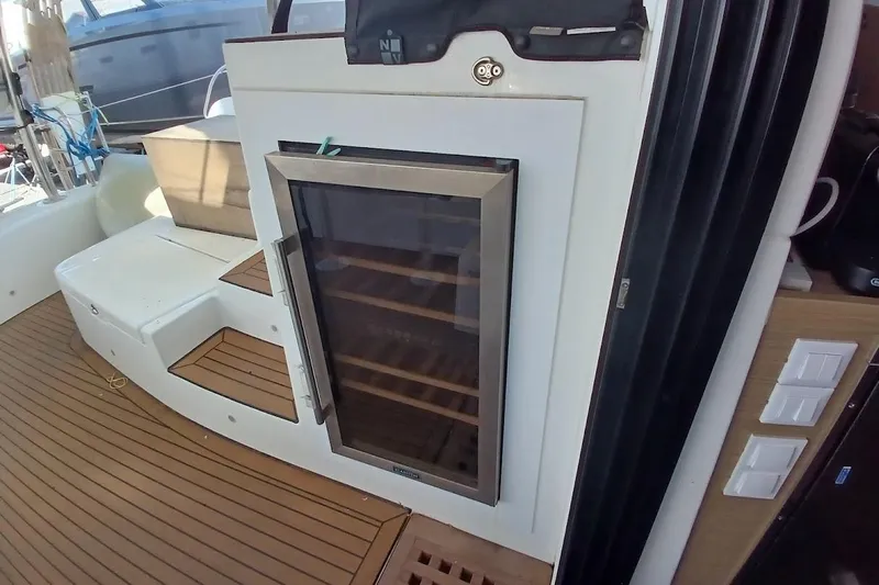 Jack Yacht Photos Pics 2024 Lagoon 42 yacht interior with built-in wine cooler and teak flooring.