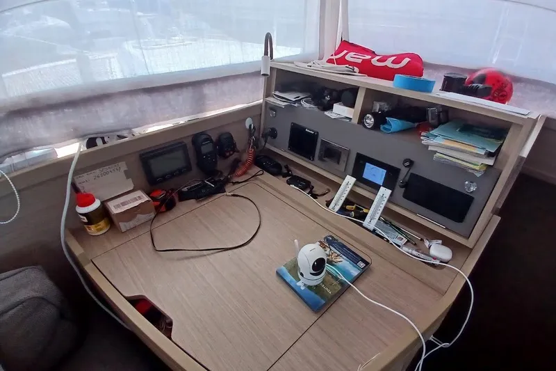 Jack Yacht Photos Pics 2024 Lagoon 42 yacht interior with navigation equipment and organized workspace.