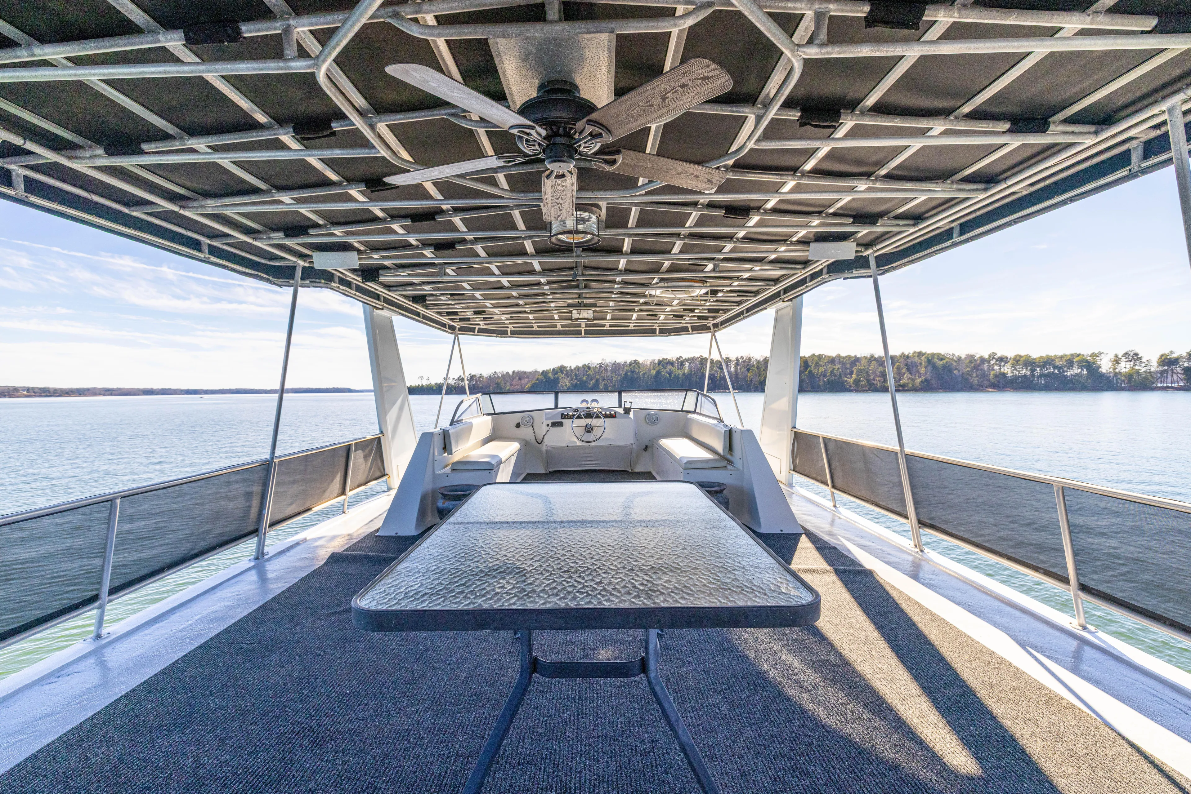  Yacht Photos Pics 1998 Stardust Cruisers Custom Luxury Houseboat with spacious deck, ceiling fan, and scenic lake view.