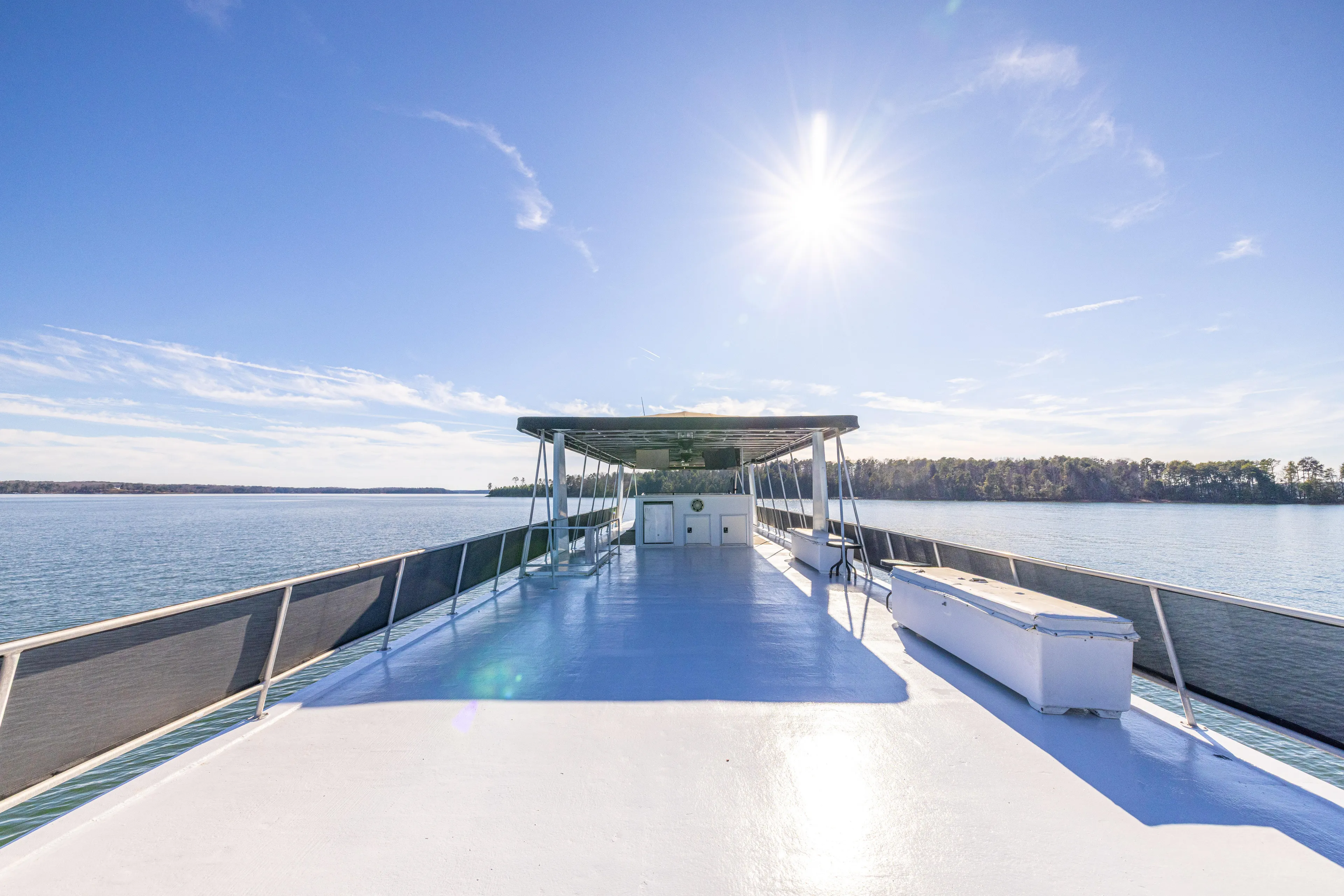  Yacht Photos Pics 1998 Stardust Cruisers Custom Luxury Houseboat on serene lake under clear blue sky.