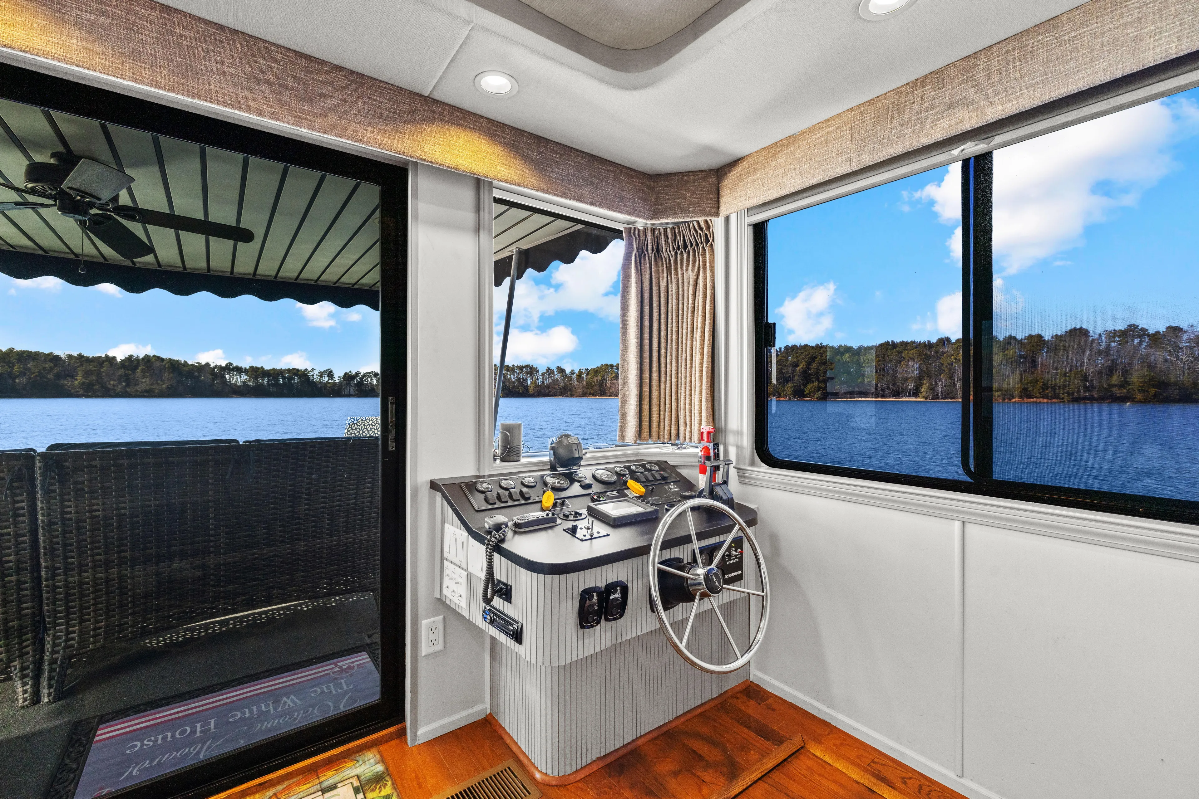  Yacht Photos Pics 1998 Stardust Cruisers Custom Luxury Houseboat interior with helm, large windows, and scenic lake view.