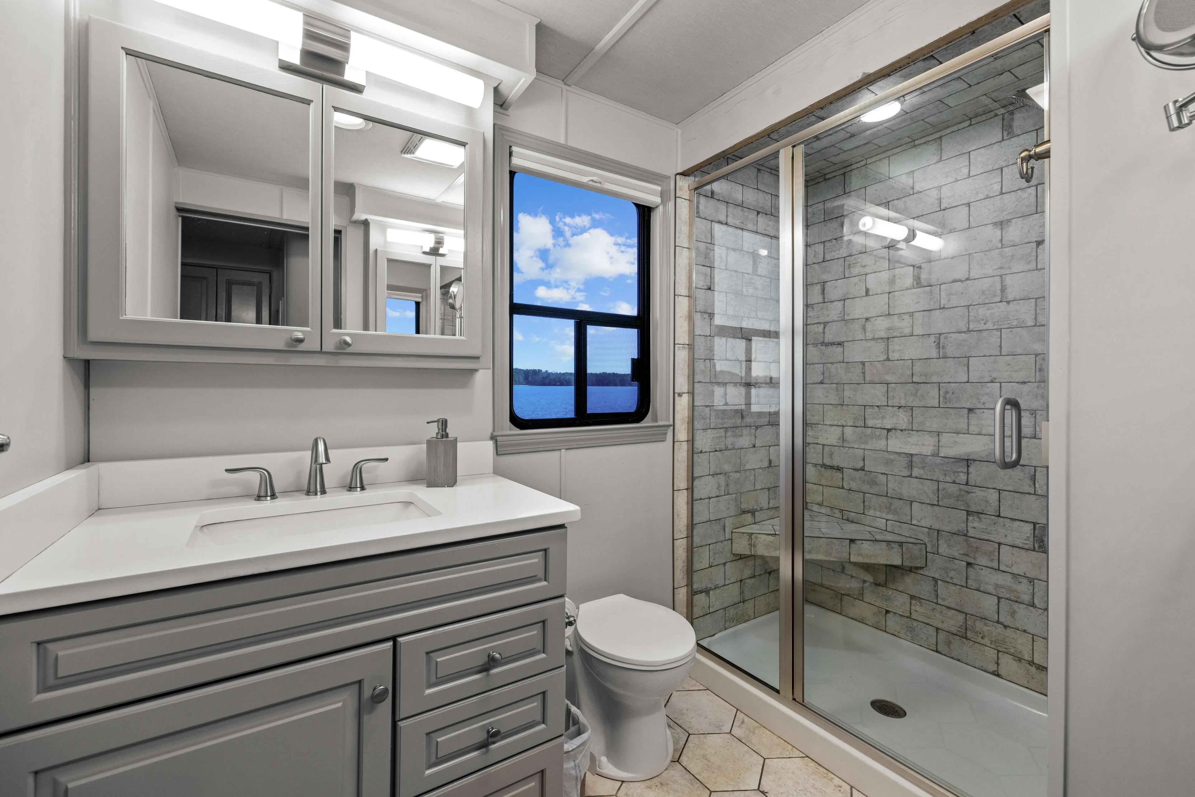  Yacht Photos Pics Luxurious bathroom in 1998 Stardust Cruisers houseboat with modern fixtures and scenic window view.