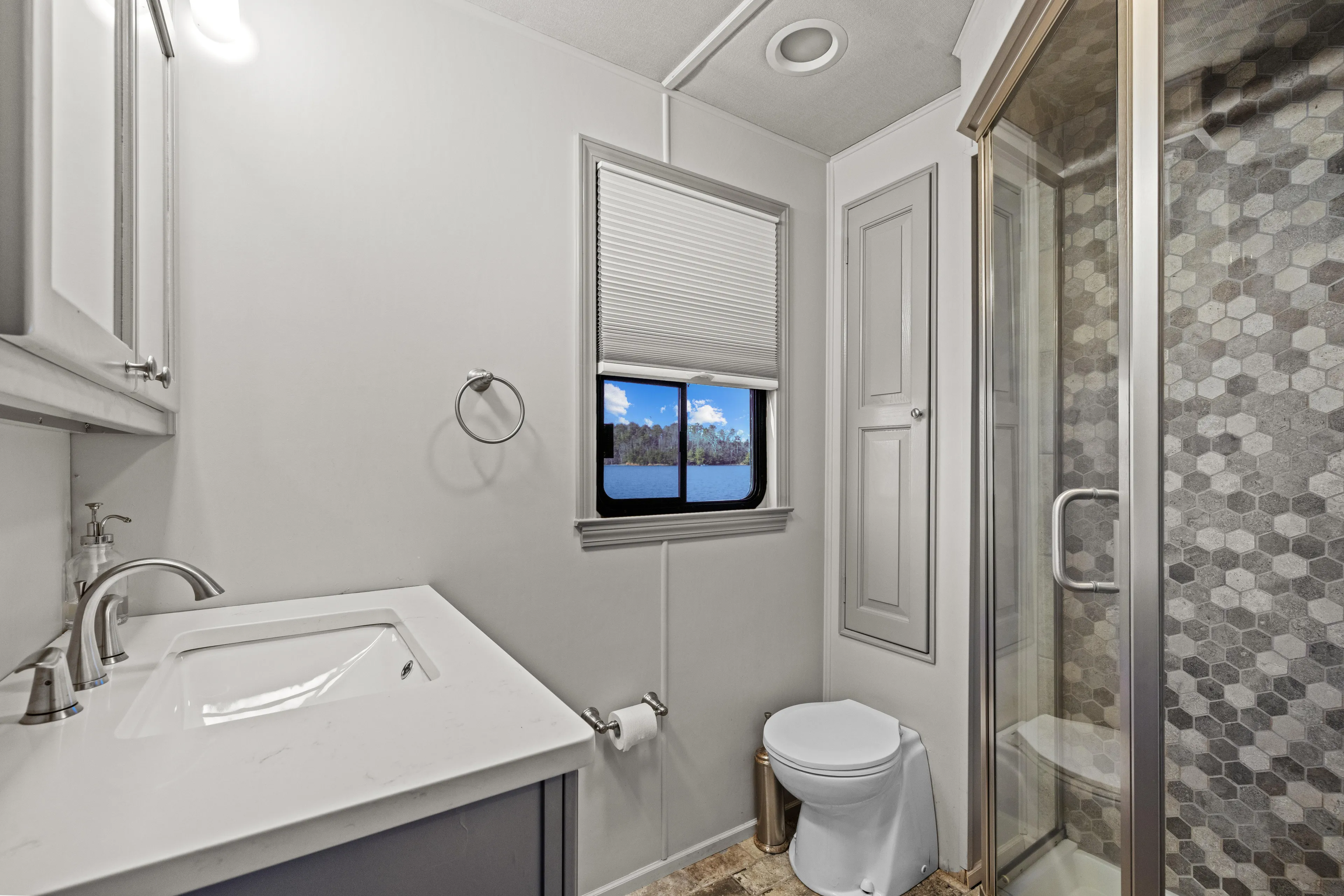  Yacht Photos Pics Luxurious bathroom in 1998 Stardust Cruisers houseboat with modern fixtures and scenic window view.