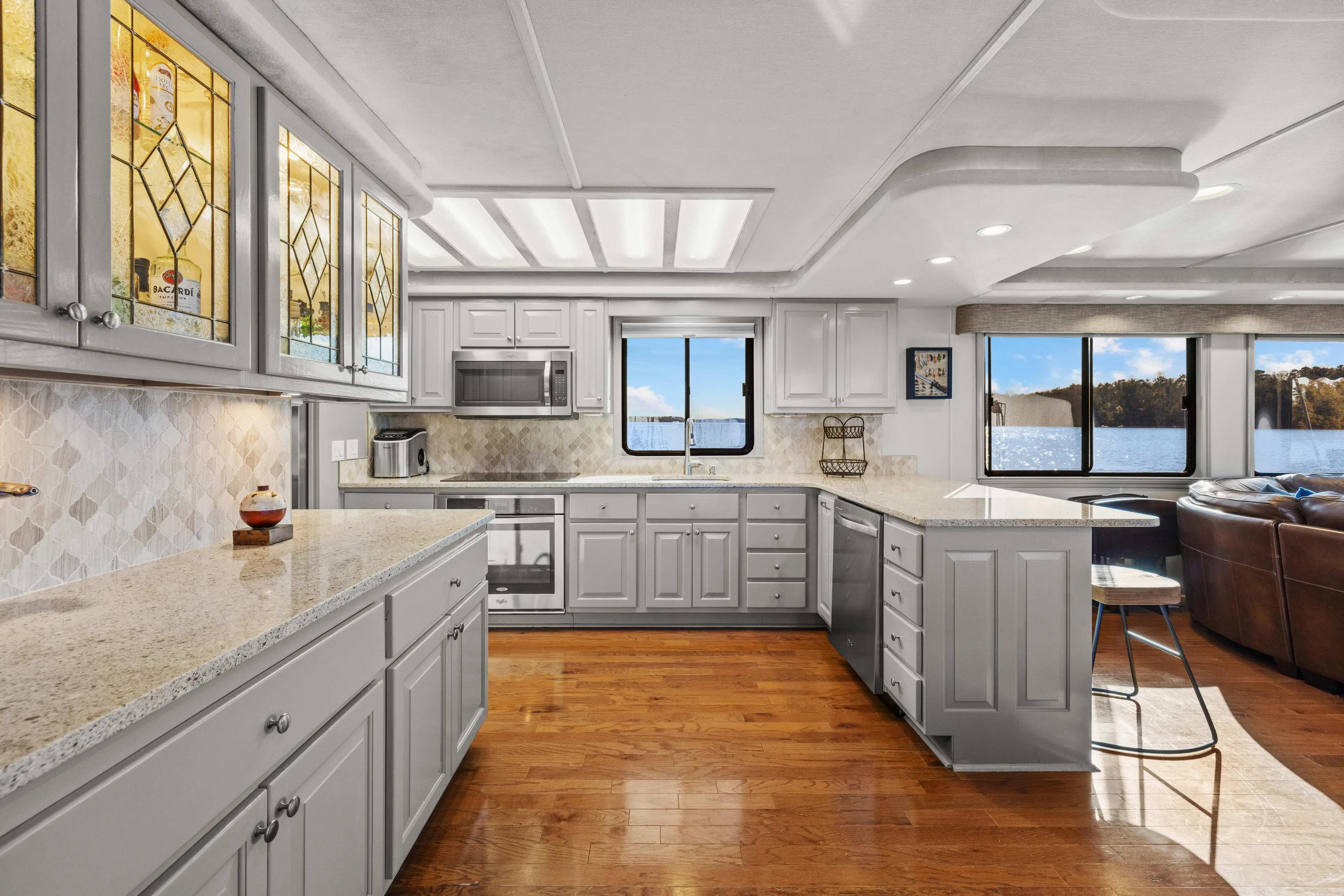  Yacht Photos Pics Luxurious kitchen interior of 1998 Stardust Cruisers houseboat with modern appliances and lake view.