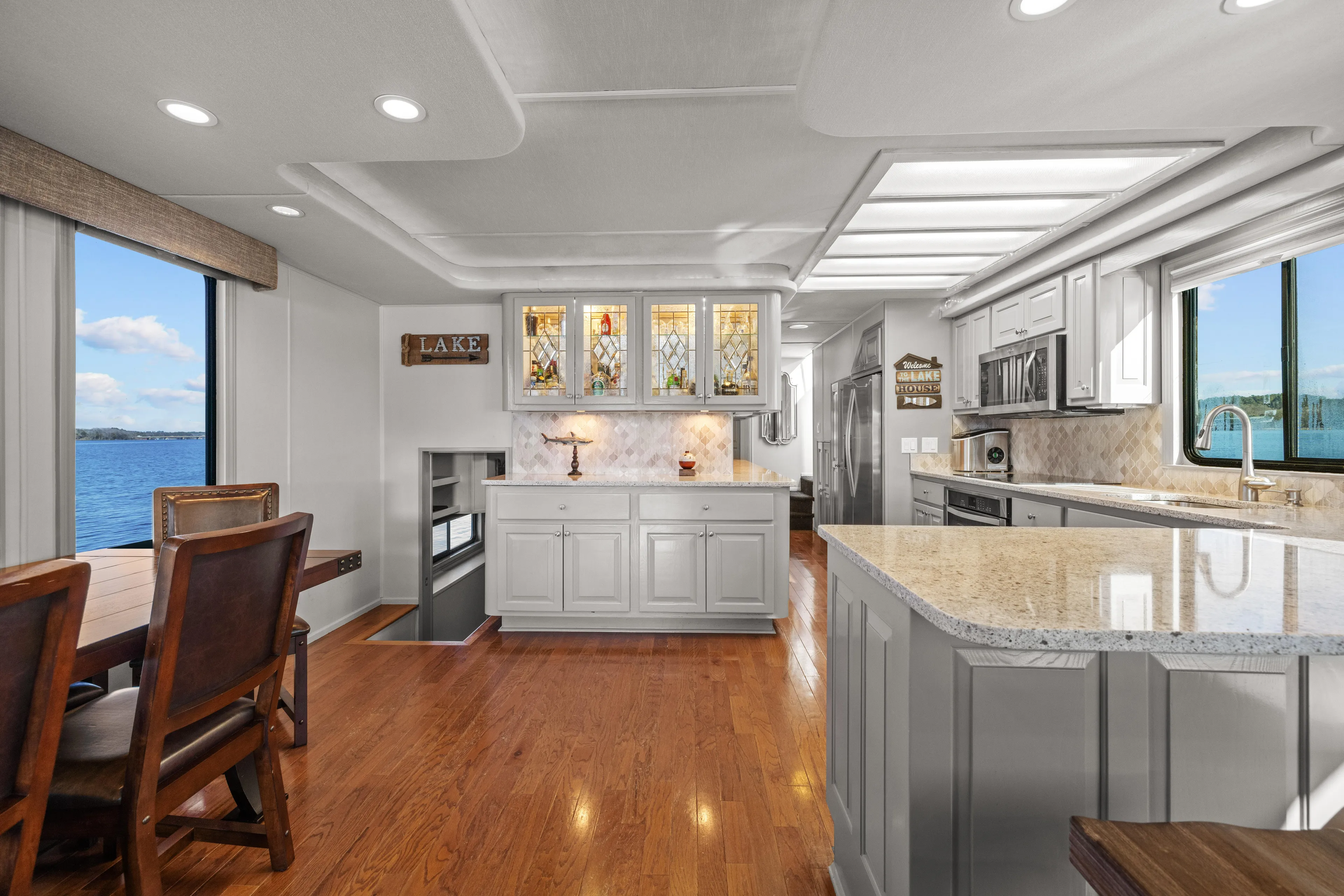  Yacht Photos Pics Luxurious 1998 Stardust Cruisers houseboat interior with modern kitchen and lake view.