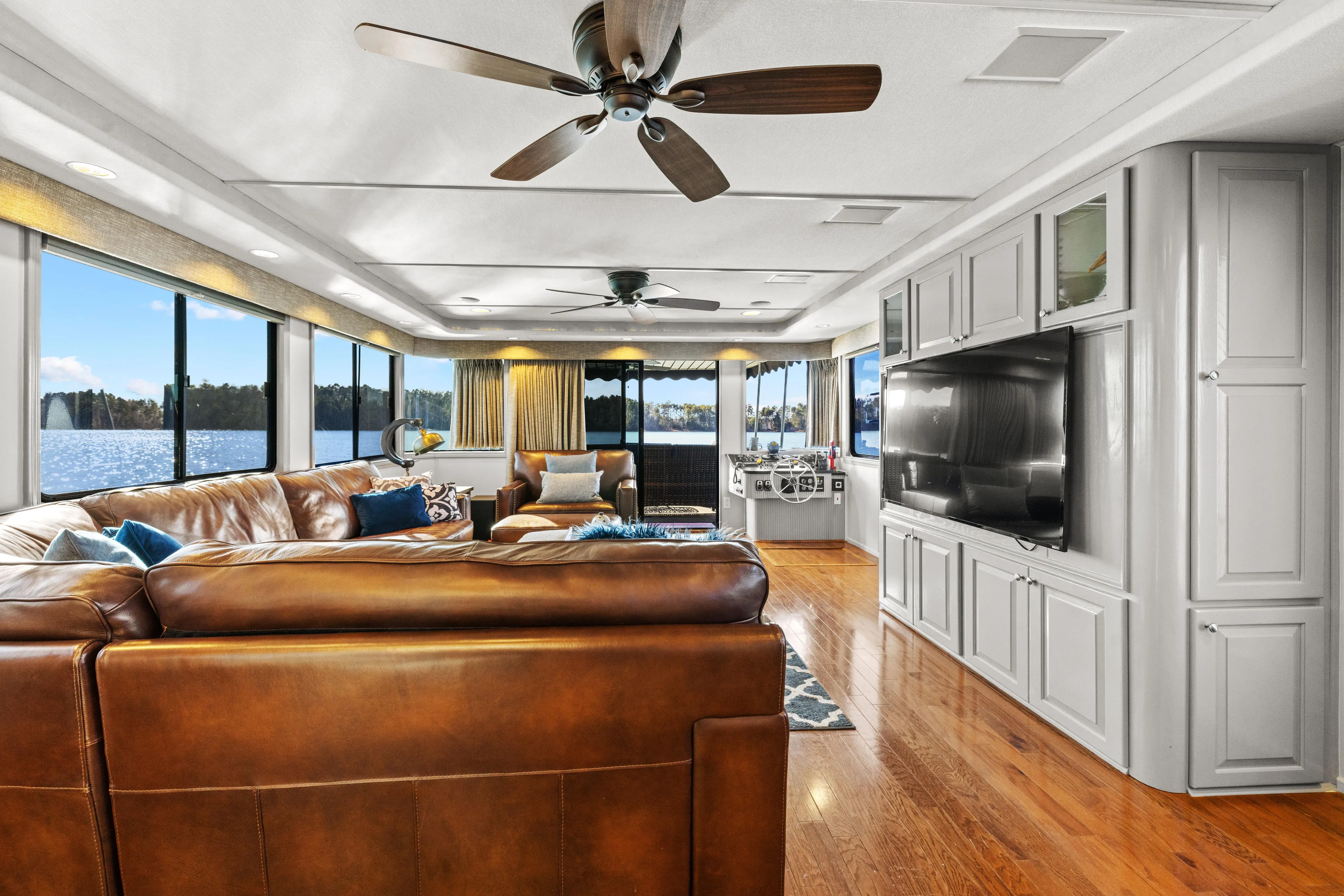  Yacht Photos Pics Luxurious 1998 Stardust Cruisers houseboat interior with leather seating, large windows, and modern amenities.