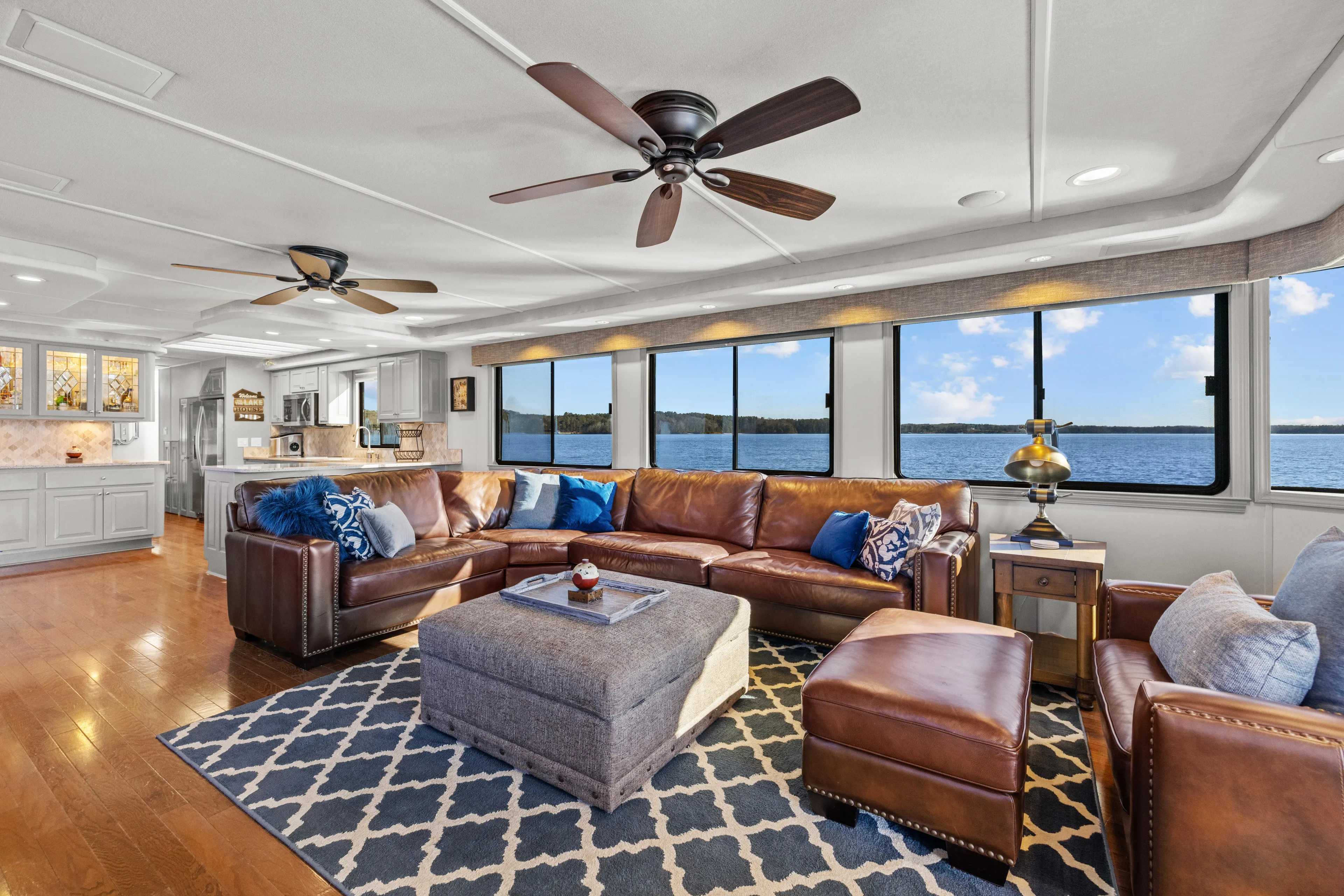  Yacht Photos Pics Luxurious 1998 Stardust Cruisers houseboat interior with leather seating, large windows, and elegant decor.