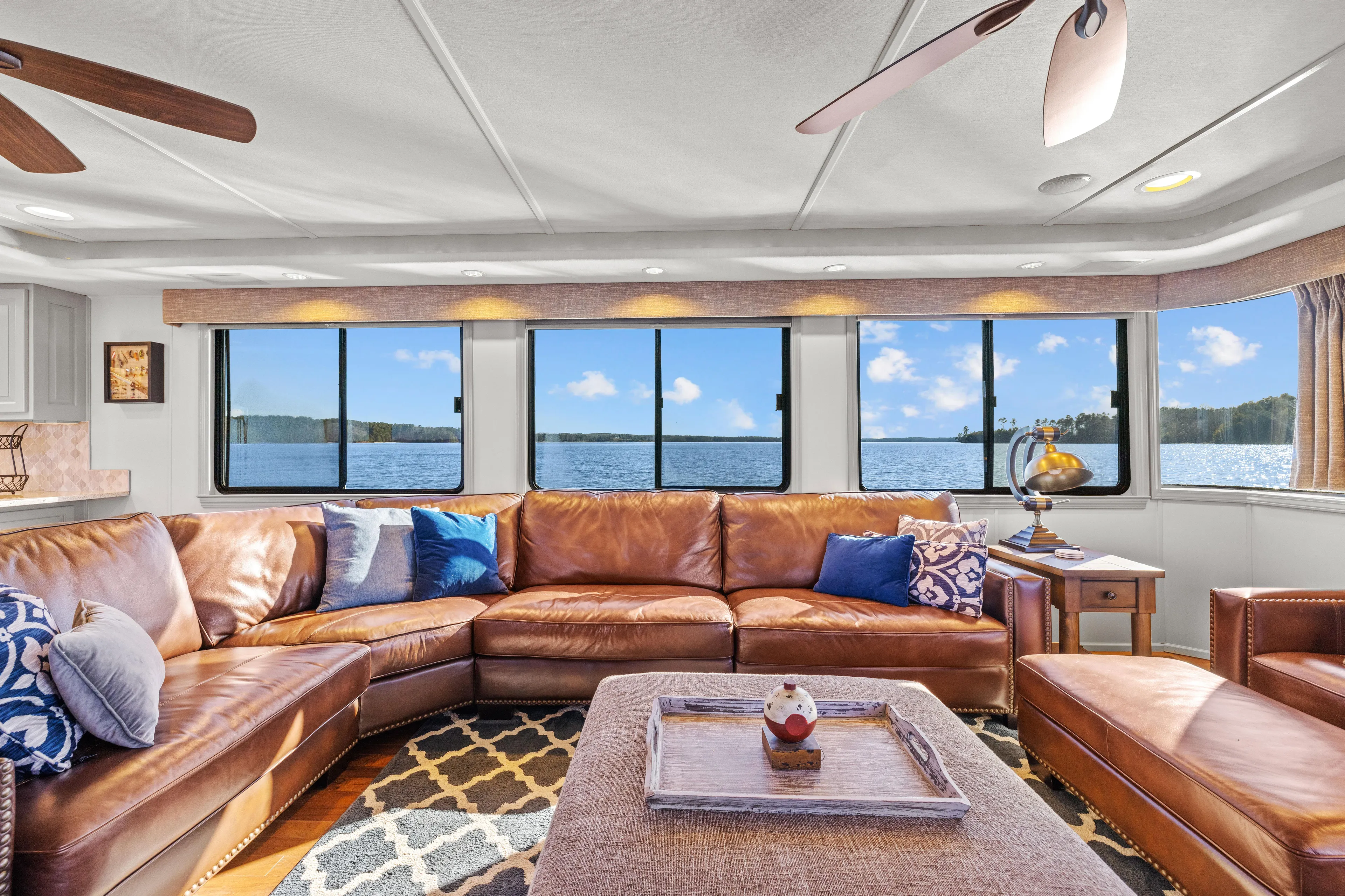  Yacht Photos Pics Luxurious 1998 Stardust Cruisers houseboat interior with leather seating and panoramic lake views.