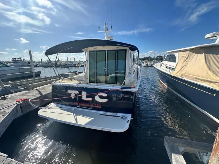 Tlc Yacht Photos Pics 2014 Back Cove 37 boat docked in Annapolis, Maryland under a clear blue sky.