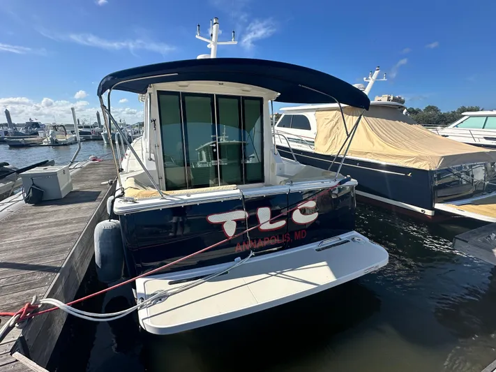 Tlc Yacht Photos Pics 2014 Back Cove 37 yacht docked in marina, Annapolis, MD, under clear blue sky.